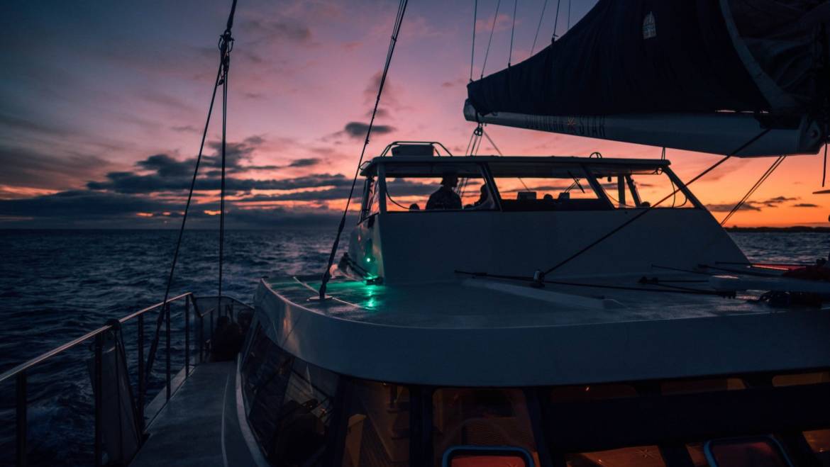 How Much Does it Cost to Maintain Catamaran? 1 book2sail-roberto nickson living on a catamaran unique sunset 1170x659 1