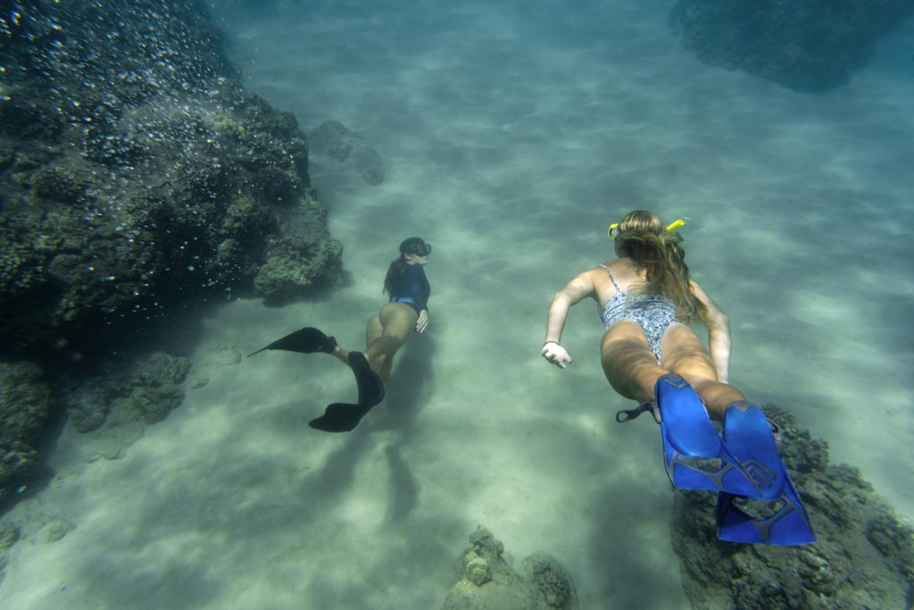 Romantic Yacht Vacation: Embrace ‘Blue Health’ with Amalfi Coast Cuisine & Serene Island Retreats 4 book2sail-women freediving with flippers underwater